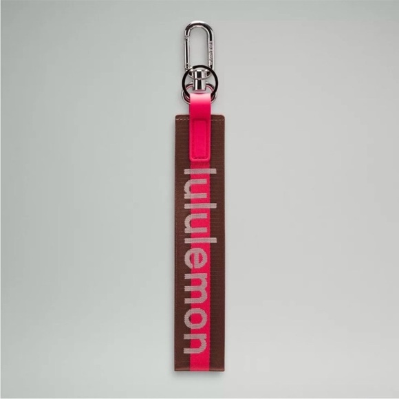 lululemon athletica Accessories - Lululemon Pink and Brown Never lost Word mark Keychain NWOT